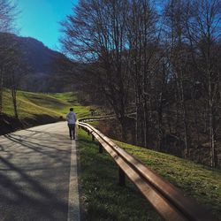 Full length of woman walking on footpath