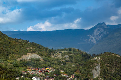 High angle view of townscape by mountains against sky