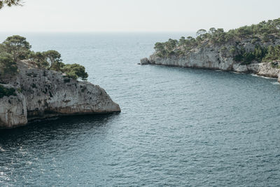 Beautiful view of the bay between rocks with vegetation in the calanques.