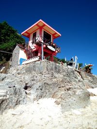 Low angle view of building against clear blue sky