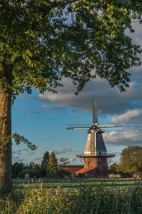 Traditional windmill against sky