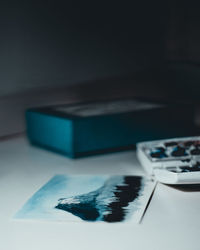 Close-up of blue paper on table