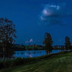 Scenic view of lake against blue sky