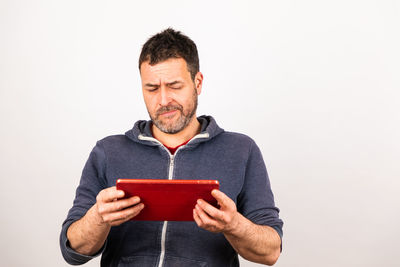 Man holding camera over white background