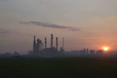 Silhouette of building at sunset