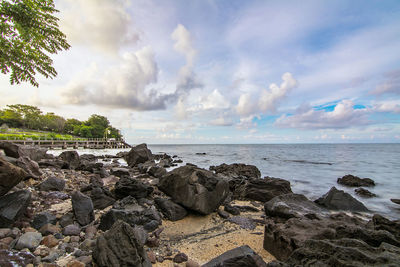 Scenic view of sea against cloudy sky