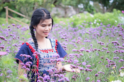 Close-up of woman with pink flowers