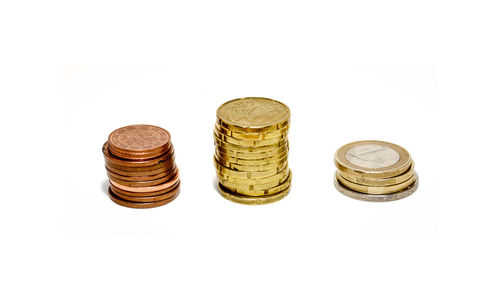 Close-up of coins on white background