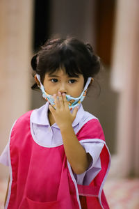Portrait of cute girl standing outdoors