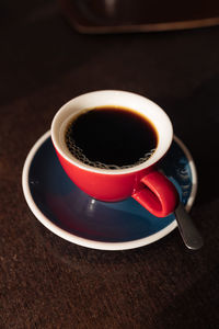 High angle view of black coffee on table