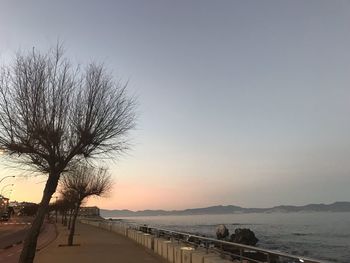 Scenic view of sea against clear sky during sunset