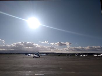 Scenic view of airport against sky on sunny day