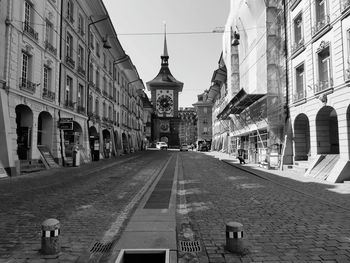 Street amidst buildings in city against sky