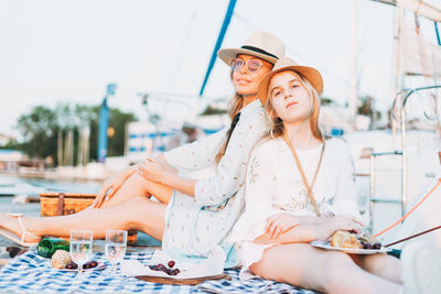 Young woman sitting in traditional clothing