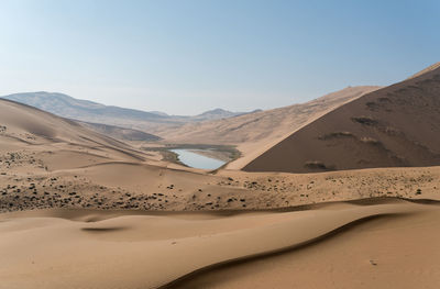 View of badain jaran desert against clear sky