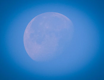 Close-up of moon against blue sky