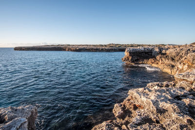 Scenic view of sea against clear sky