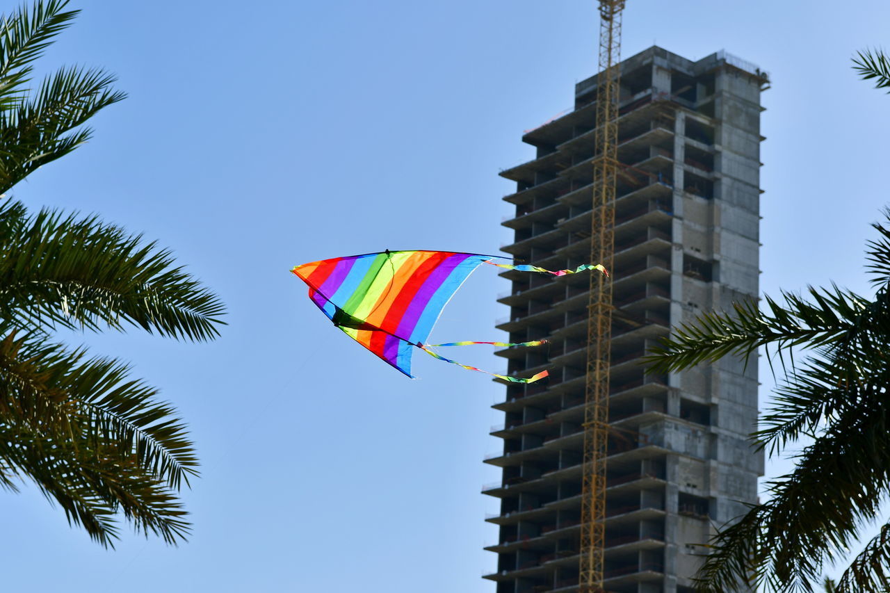 LOW ANGLE VIEW OF MULTI COLORED BUILDING