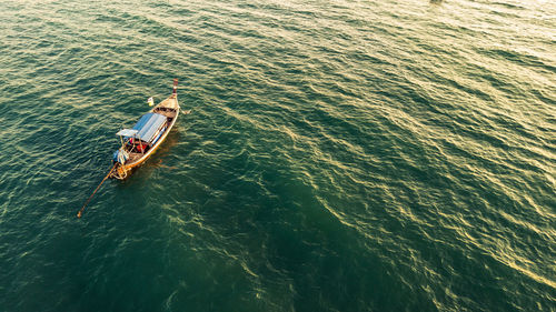 High angle view of boat sailing in sea
