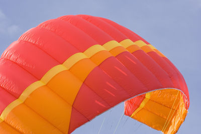 Low angle view of hot air balloon flying against sky