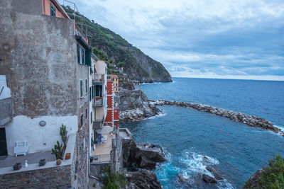 Panoramic view of sea and buildings against sky