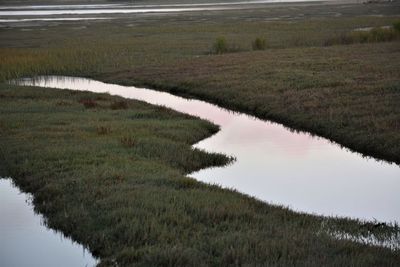 Scenic view of landscape by lake