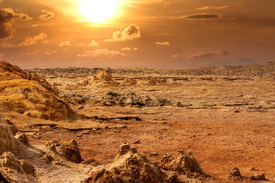 Scenic view of landscape against sky during sunset