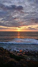 Scenic view of sea against sky at sunset