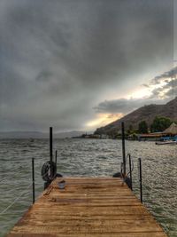 Pier over sea against sky