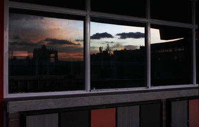 Clouds over city at sunset