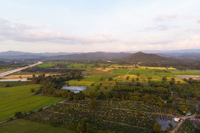 Scenic view of agricultural field against sky