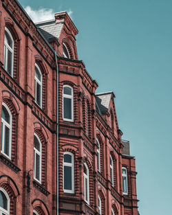 Low angle view of building against blue sky