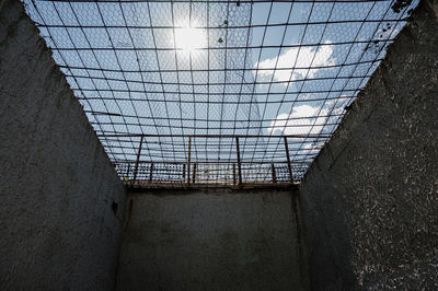 Low angle view of skylight in abandoned building