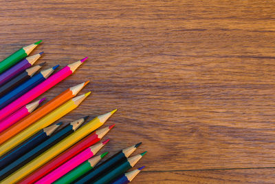 High angle view of multi colored pencils on table