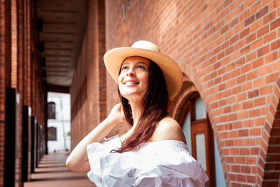 Beautiful young woman wearing a traditional hat from aguadas in colombia called an aguadeño hat.