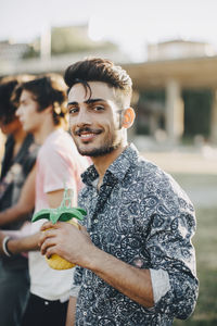 Portrait of young couple standing outdoors