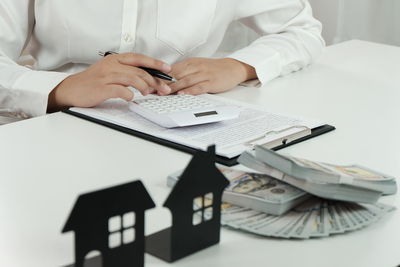 Low angle view of woman using mobile phone on table