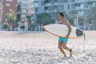 Full length of man standing on beach