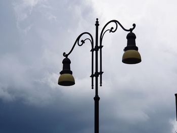 Low angle view of street light against sky