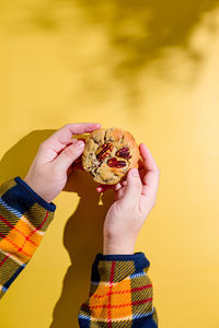 Cropped hand of woman holding fruit