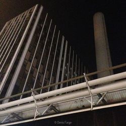 Low angle view of modern building at night