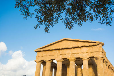 Low angle view of historical building against blue sky