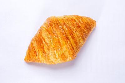Close-up of bread on white background
