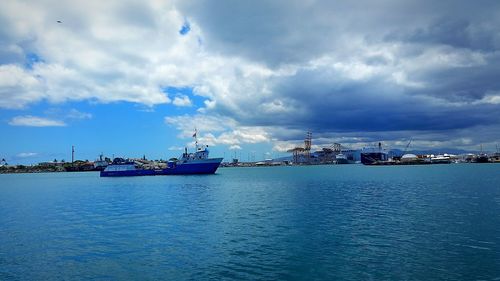 Boats moored at harbor