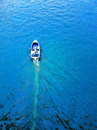 High angle view of man swimming on tje boat in sea