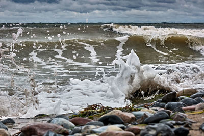 Waves splashing on rocks at shore