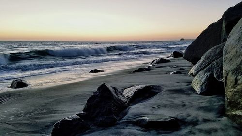 Scenic view of sea at sunset