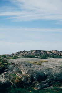 Rock formations on landscape against sky