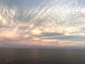 Scenic view of sea against sky at sunset