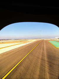 Road seen through airplane window